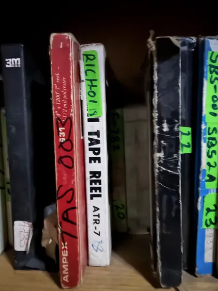 Labelled reel boxes stacked flat.